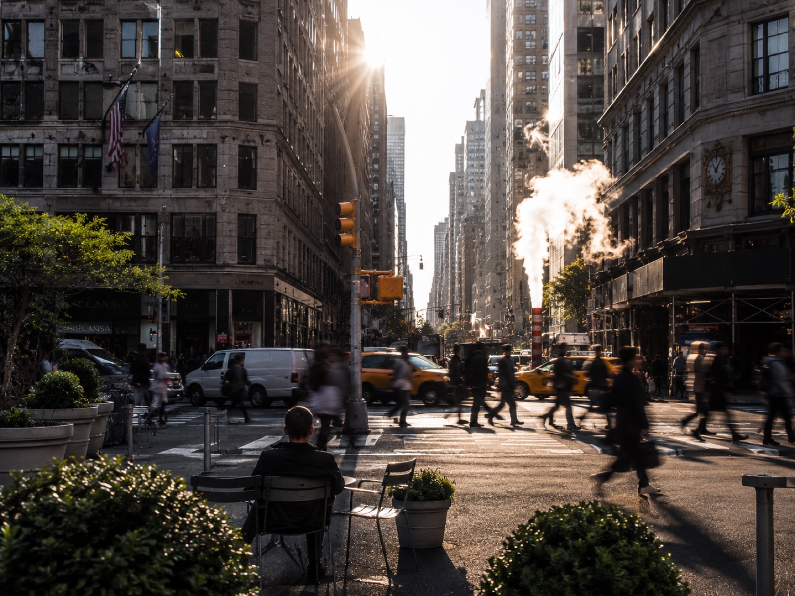 A New York street at sunrise, steam rising over the crosswalk